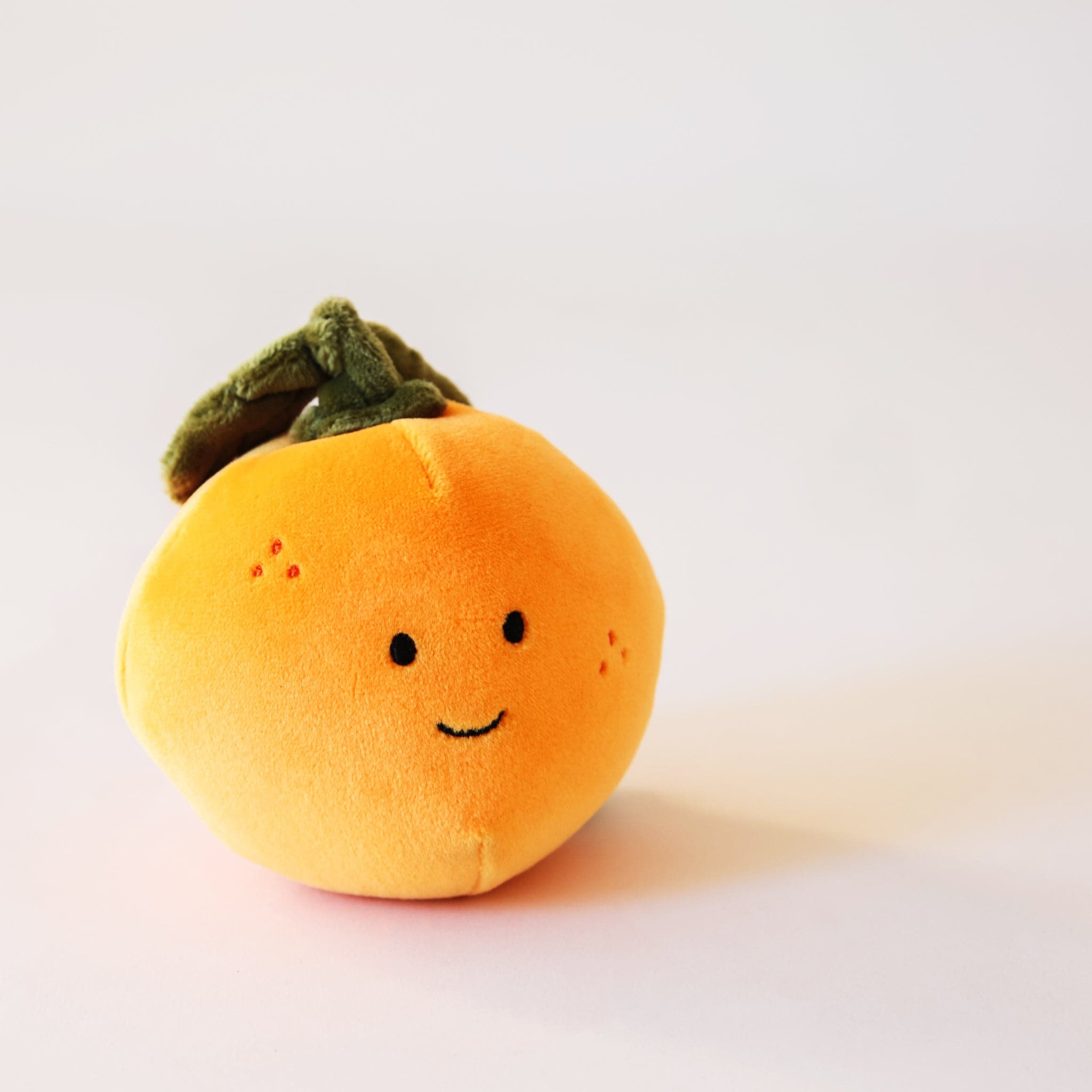 Adorable, plush oranges with sweet smiles and speckled cheeks. With floppy green leaves, these oranges are the absolute cutest. Their fur is soft and their leaves are floppy
