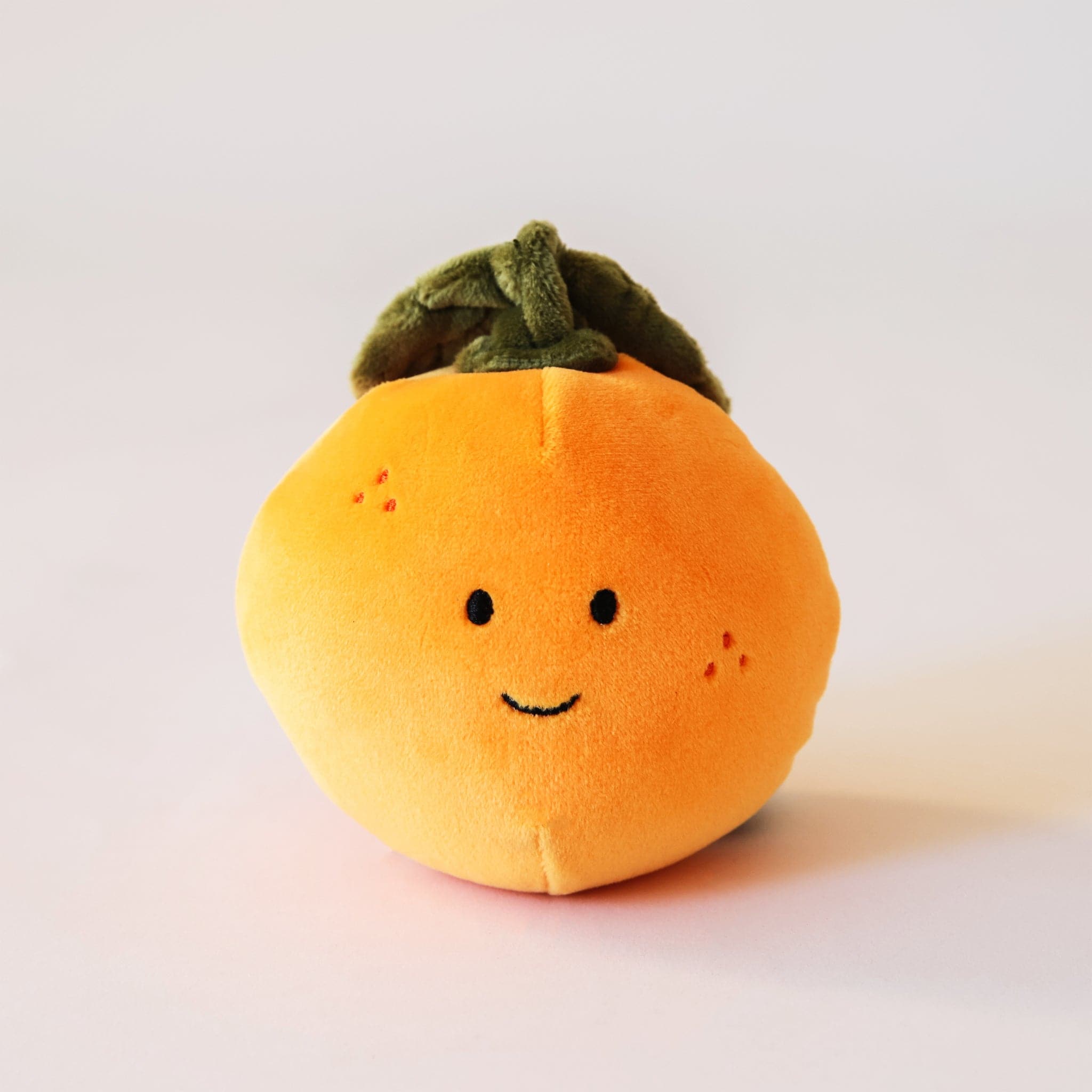 Adorable, plush oranges with sweet smiles and speckled cheeks. With floppy green leaves, these oranges are the absolute cutest. Their fur is soft and their leaves are floppy.
