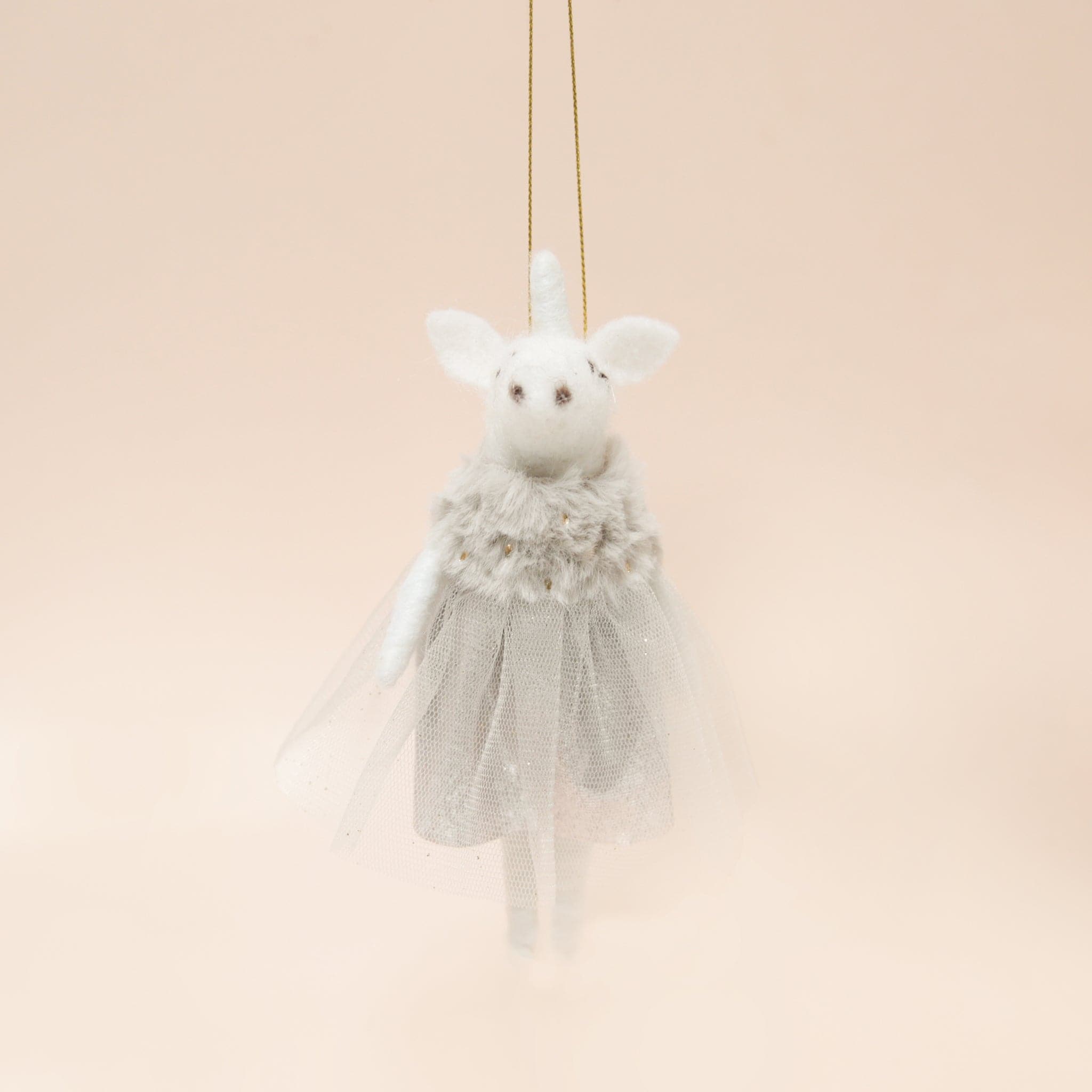 A white felt unicorn ornament with a grey tulle dress.