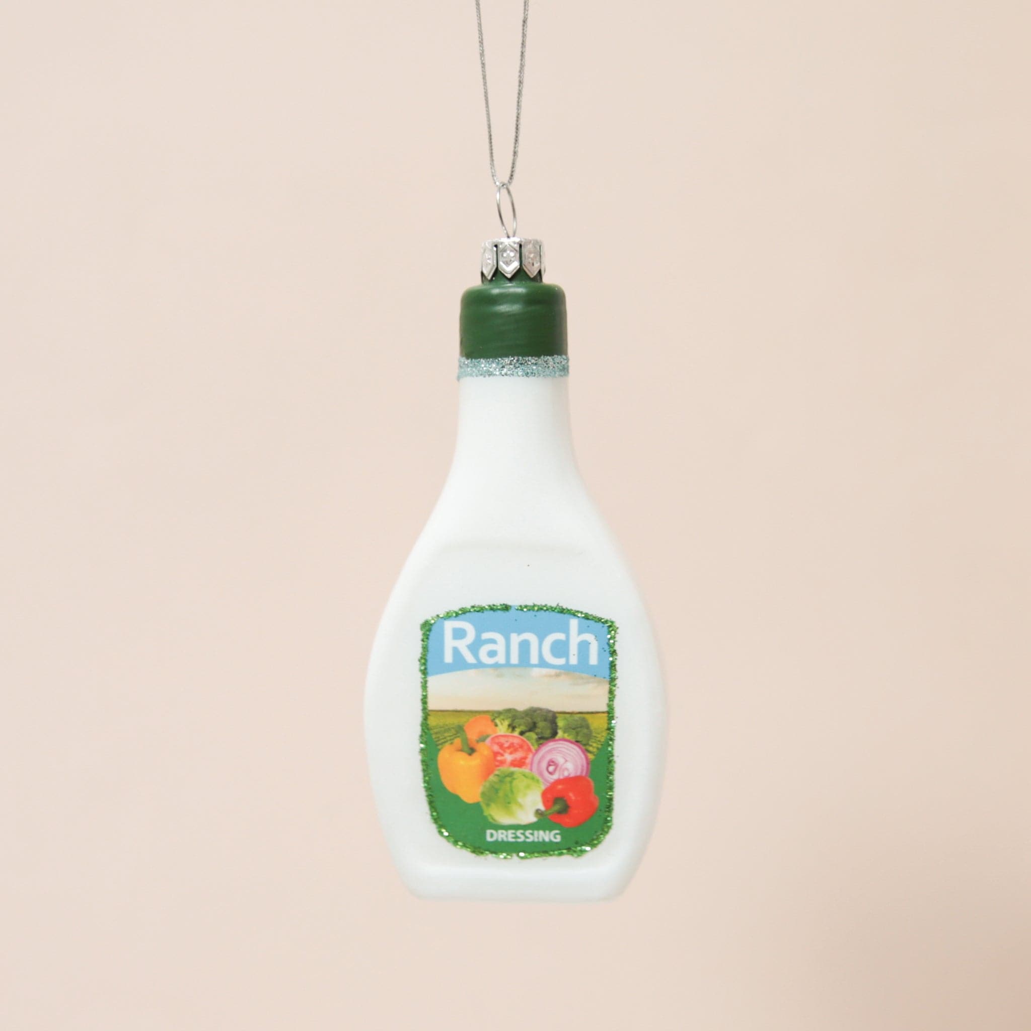 A glass bottle or ranch ornament with a 3.5" loop for hanging and glitter detailing.