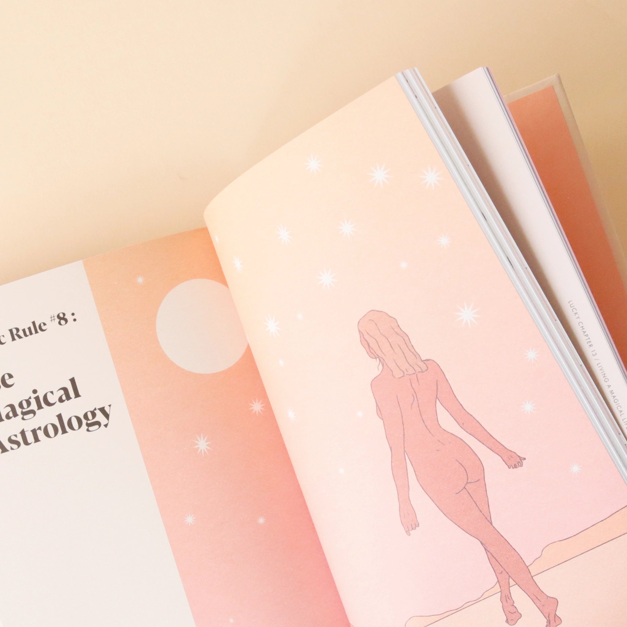 A peek inside the book, this page has an illustration of a nude woman walking away created with shades of orange a pinks. 