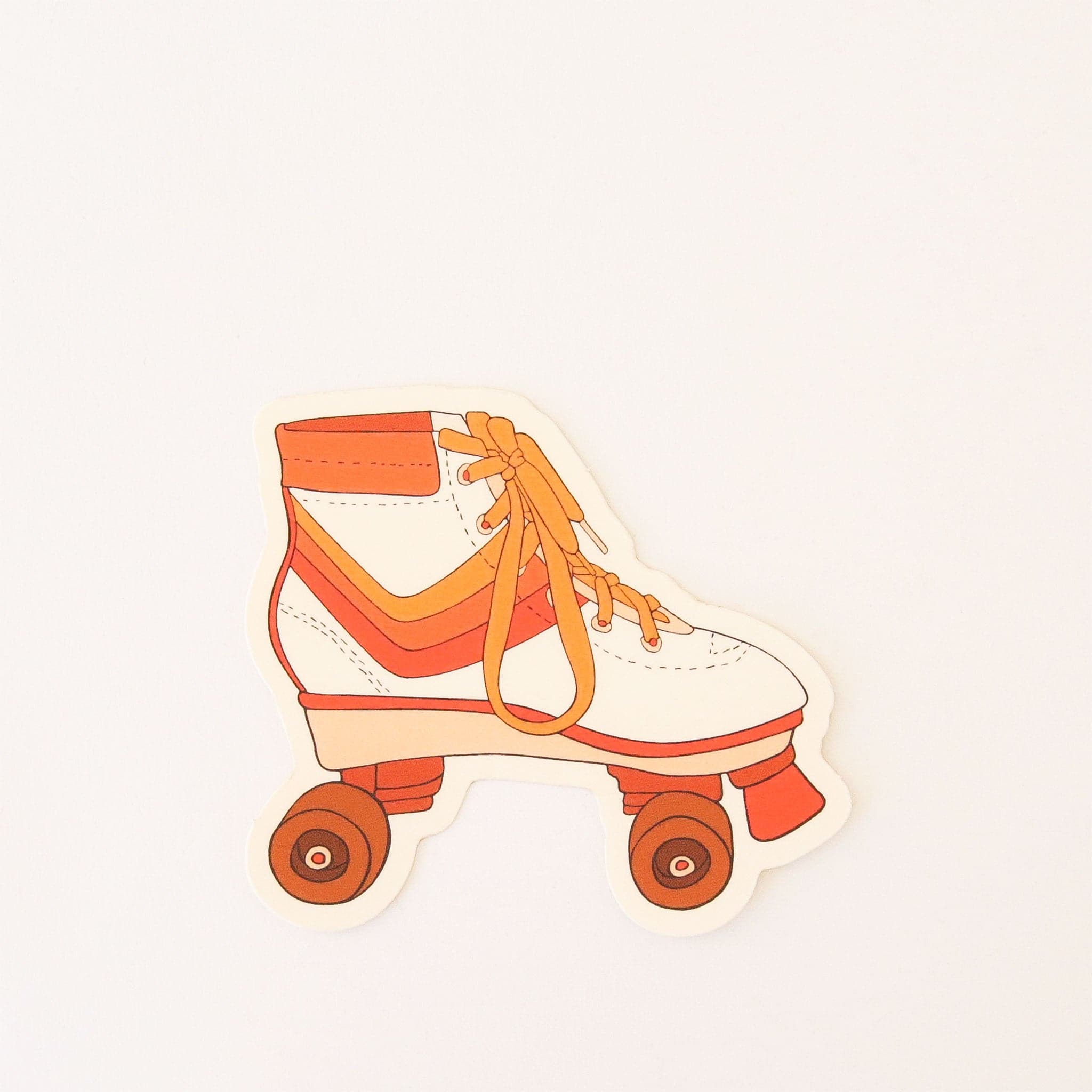 This is a white sticker cut into the shape of the side view of a roller skate. The skate has mustard yellow laces. There is a mustard yellow, light orange and orange stripe in the middle. There are two dark orange wheels and an orange stopper on the front. 