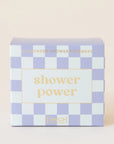 A box of shower steamers in a packaging with purple and white checkered and light yellow text that reads, "So Fresh, So Clean".