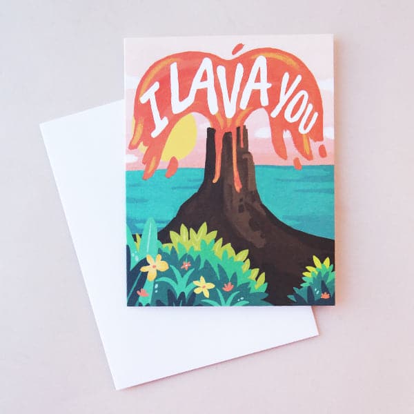 A card featuring an illustration of a tropical scene with the ocean in the background and a volcano erupting with red lava and white letters that read, " I Lava You" alongside a white envelope.