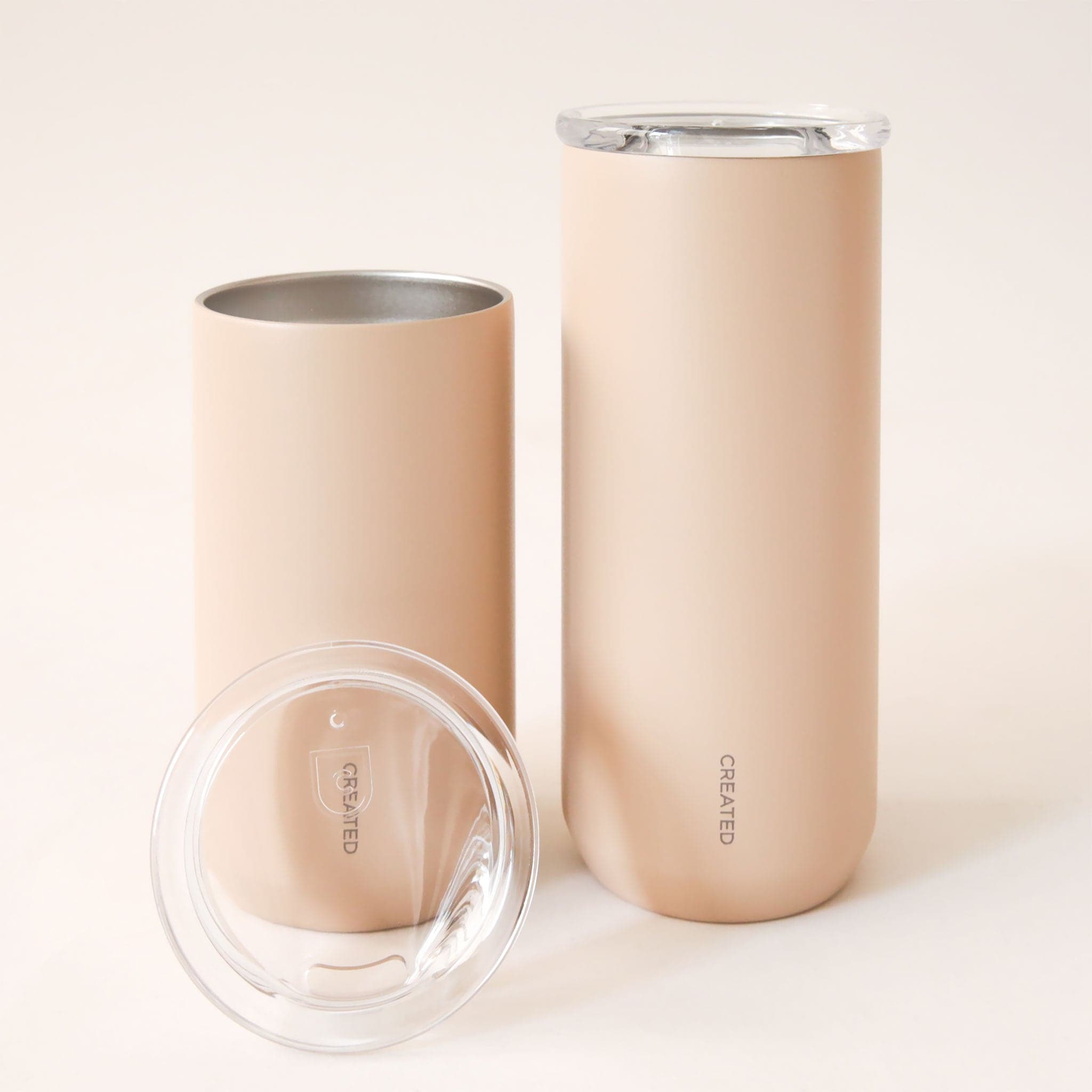 A bullet shaped to-go tumbler in a light shade of pink.