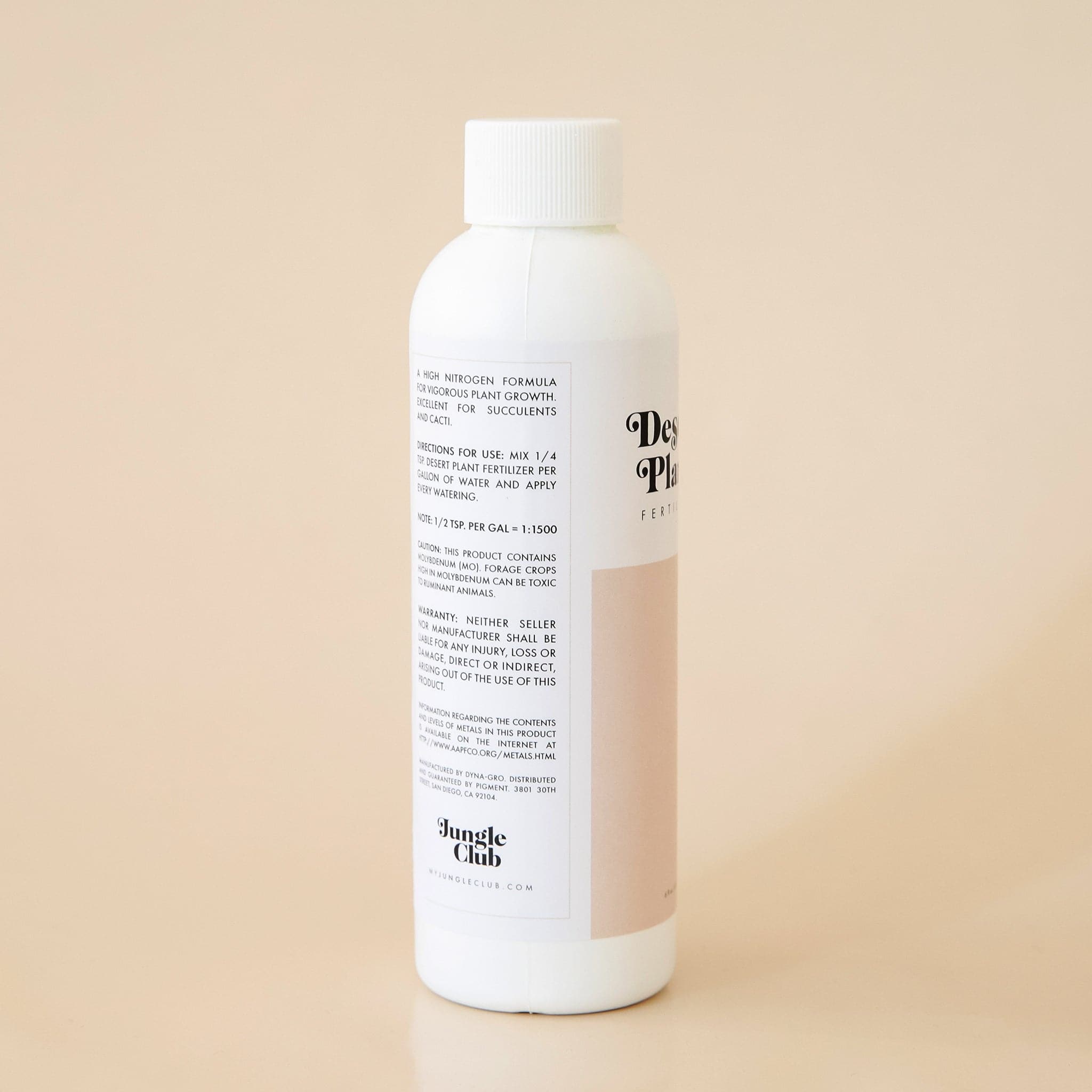 The wrap around label also includes a step-by-step directions sections and manufacture contact information. Similar to the ingredients lists, this section is outlined with a thin, soft beige border.  Below the directions is the company logo reading &#39;Jungle Club&#39; in black lettering. 