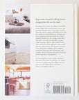 Back of the hardcover book reading 'Step inside beautiful rolling homes designed for life on the road' on the right hand side. To the left is three blocks highlighting a bedroom interior, coastal RV exterior and a vibrant space within another RV interior. 