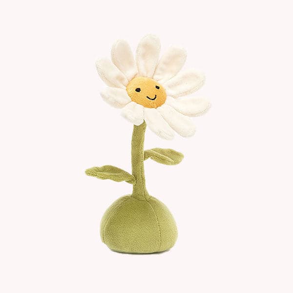 On a white background is a daisy stuffed toy with a yellow center with a smiling face, white petals and a green stem and base. 