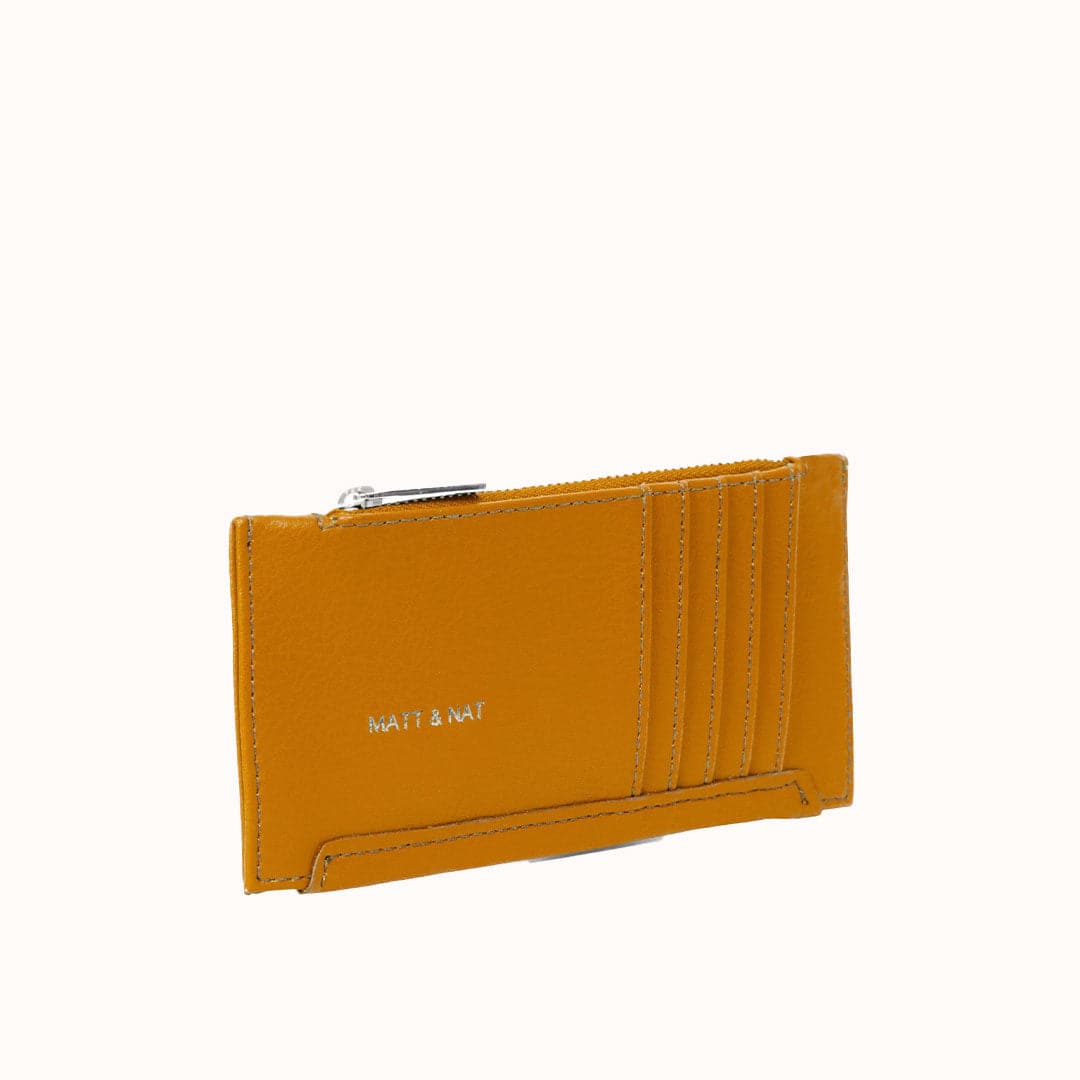 A slim, mustard yellow, card holder with a zipper pocket along the top to secure coins, cash or other small things you may need to store.