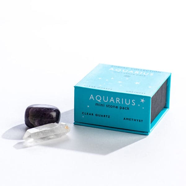 A bright blue magnetic box featuring the Aquarius&#39; mini stone pack. It includes a clear quartz crystal and an amethyst 