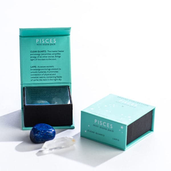 A turquoise magnetic box featuring the Pisces mini stone pack. It includes a clear quartz crystal and a tumbled lapis stone.