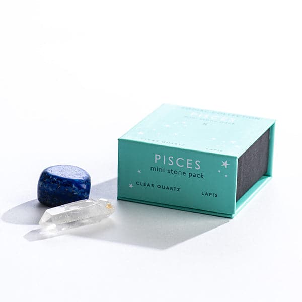 A turquoise magnetic box featuring the Pisces mini stone pack. It includes a clear quartz crystal and a tumbled lapis stone.