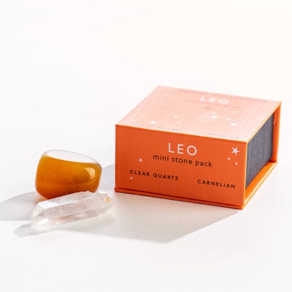 An orange magnetic box featuring the Leo&#39;s mini stone pack. It includes a clear quartz crystal and a tumbled carnelian.