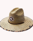 Against a white background is the top view of a wide brim, straw hat. The brim has a black and brown cheetah print border. On the front of the hat is a cheetah print diamond with three white trees inside. The black drawstring goes around half of the top of the hat.