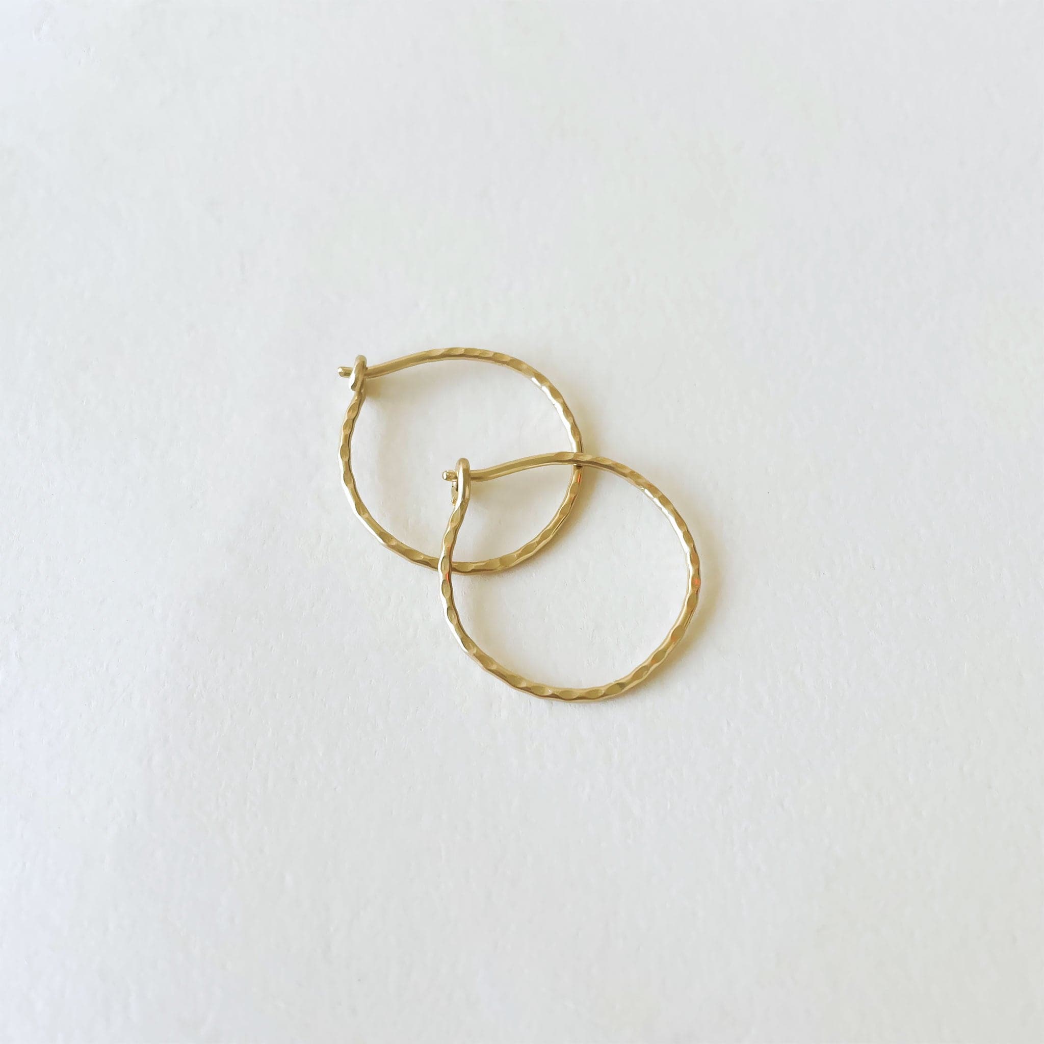 The smallest size of the hammered 14k gold hoops.