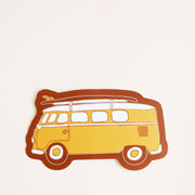 This vinyl sticker has a classic daffodil yellow VW Bug with a surfboard fastened on top, providing that classic beach cruiser vibe. The sticker has tawny brown bubble border.