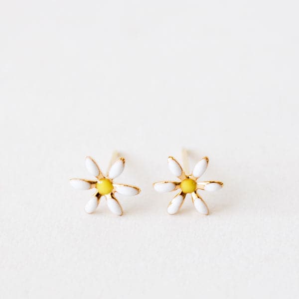 Small daisy stud earrings with a yellow center and white petals. The material is gold plated and the post is a straight back.