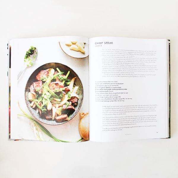 A look inside of the book that features a photograph of the meal and then the description and recipe on the next page.