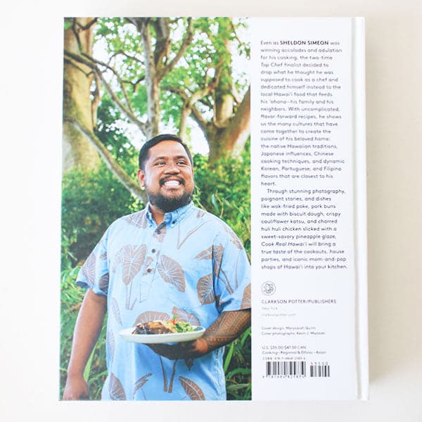 The back of the book that features a photograph of the author holding a plate of food and a blurb on the right hand side about them.