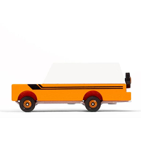 In front of a white background is the side view of an orange wood car. The top of the car is white. There are two black vertical lines down the side of the car. The tires are black with orange rims. There is a matching tire on the back of the car. 