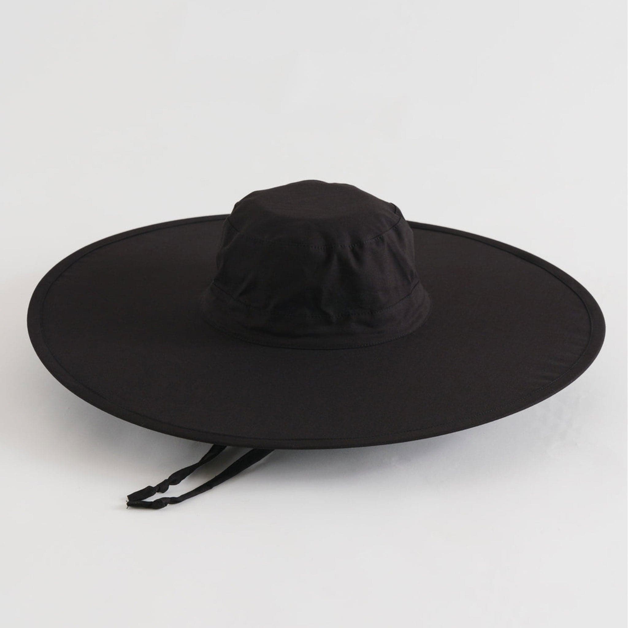 A black wide brim nylon hat with a neck strap.