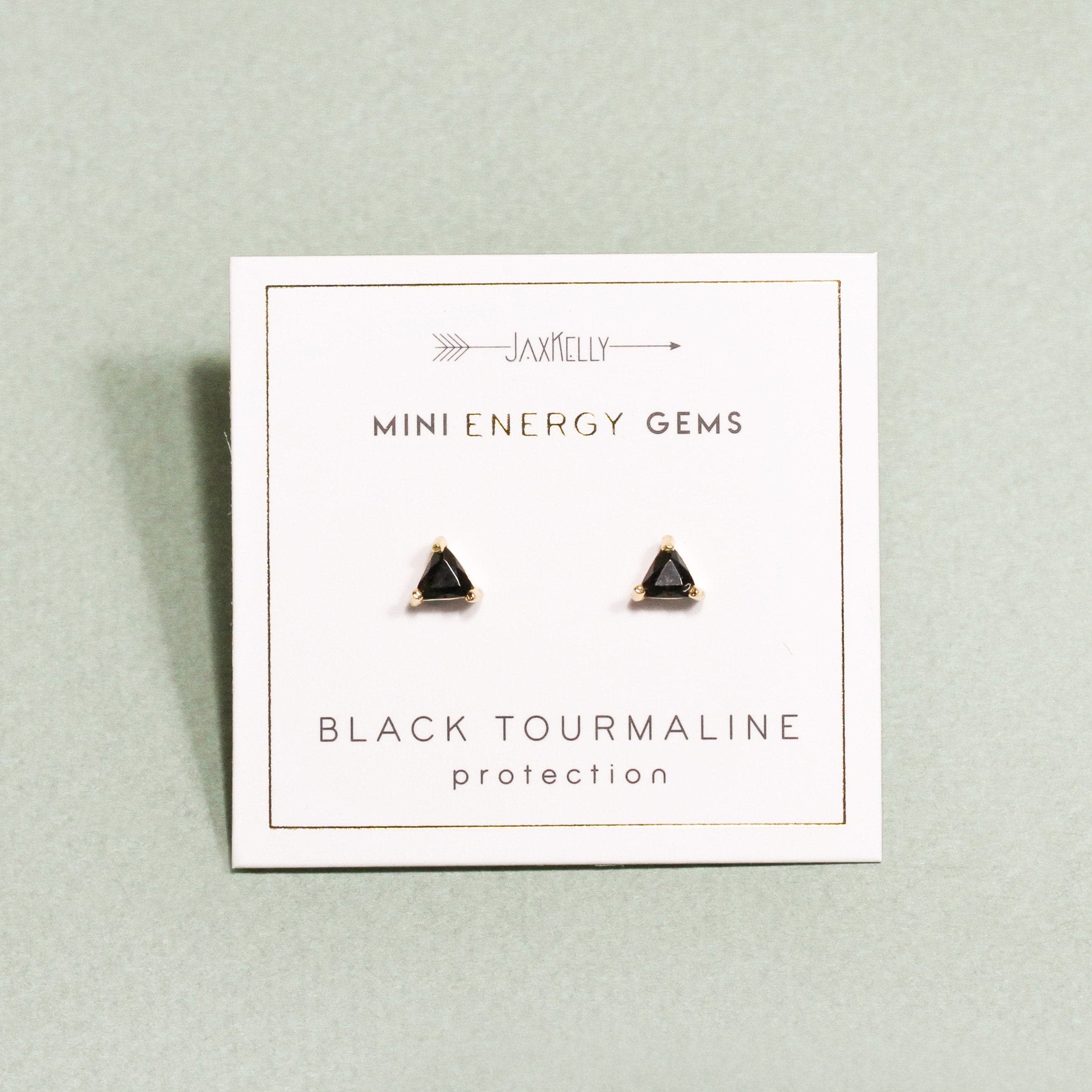 A triangle stud earring made of black tourmaline and 18k gold plated details and post.