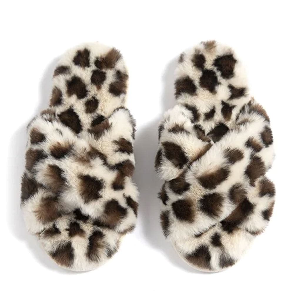 Fuzzy leopard slippers with a crisscross detail.