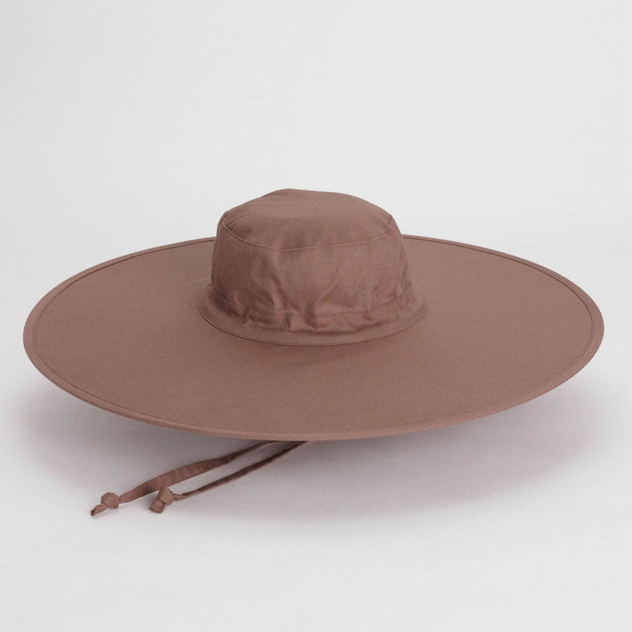 A purple / brown wide brim nylon hat with a neck strap.