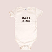 White baby onesie with black lettering on chest, "Baby Bird"