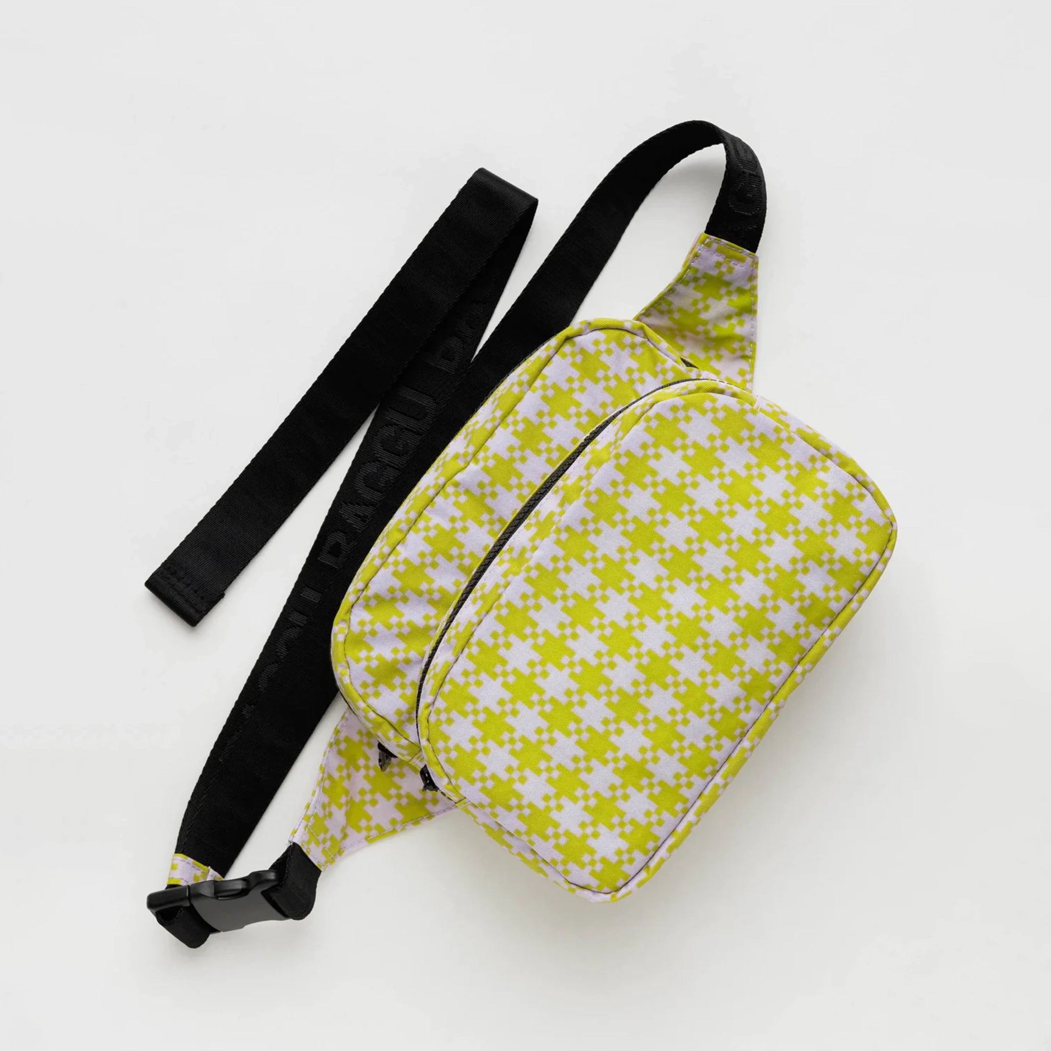 A light pink and lime green gingham nylon fanny pack with two zipper pockets and a black adjustable strap.