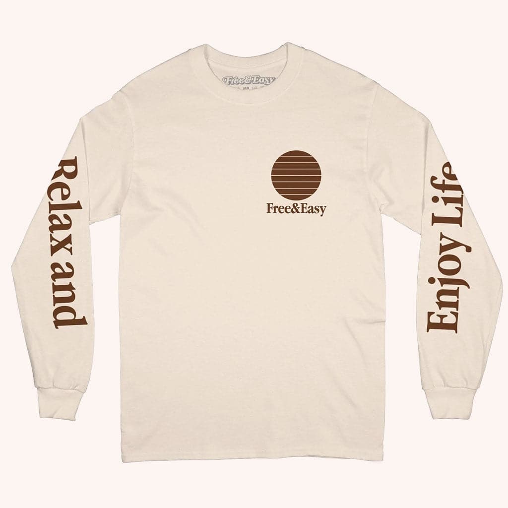 The front of this t-shirt says, "Relax and Enjoy Life" on each of the sleeves along with a small circle graphic design on the left corner of the shirt.