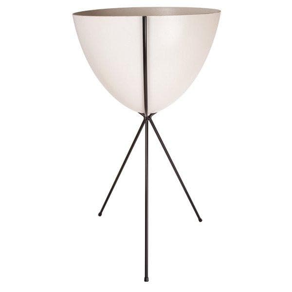In front of a white background is a white colored bullet planter. The planter has a wide top and narrows at the bottom. The planter is held up by a black metal stand. The stand has three black metal legs.