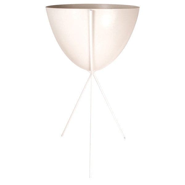 In front of a white background is a white colored bullet planter. The planter has a wide top and narrows at the bottom. The planter is held up by a white metal stand. The stand has three white metal legs.