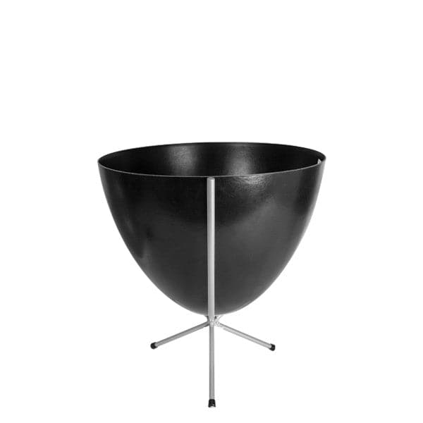 In front of white background is a black planter in a short silver metal stand. The bullet planter is wide at the top and narrow at the bottom. The metal stand has three legs. 