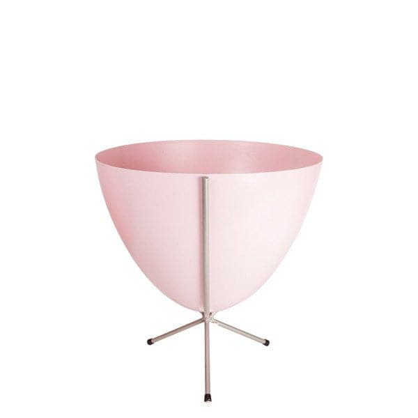In front of white background is a pink planter in a short silver metal stand. The bullet planter is wide at the top and narrow at the bottom. The metal stand has three legs. 