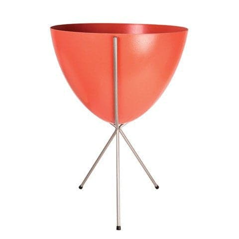 In front of white background is a red planter in a silver metal stand. The bullet planter is wide at the top and narrow at the bottom. The metal stand has three legs. 
