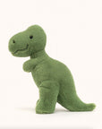 Soft stuffed animal in the shape of a green T-Rex.