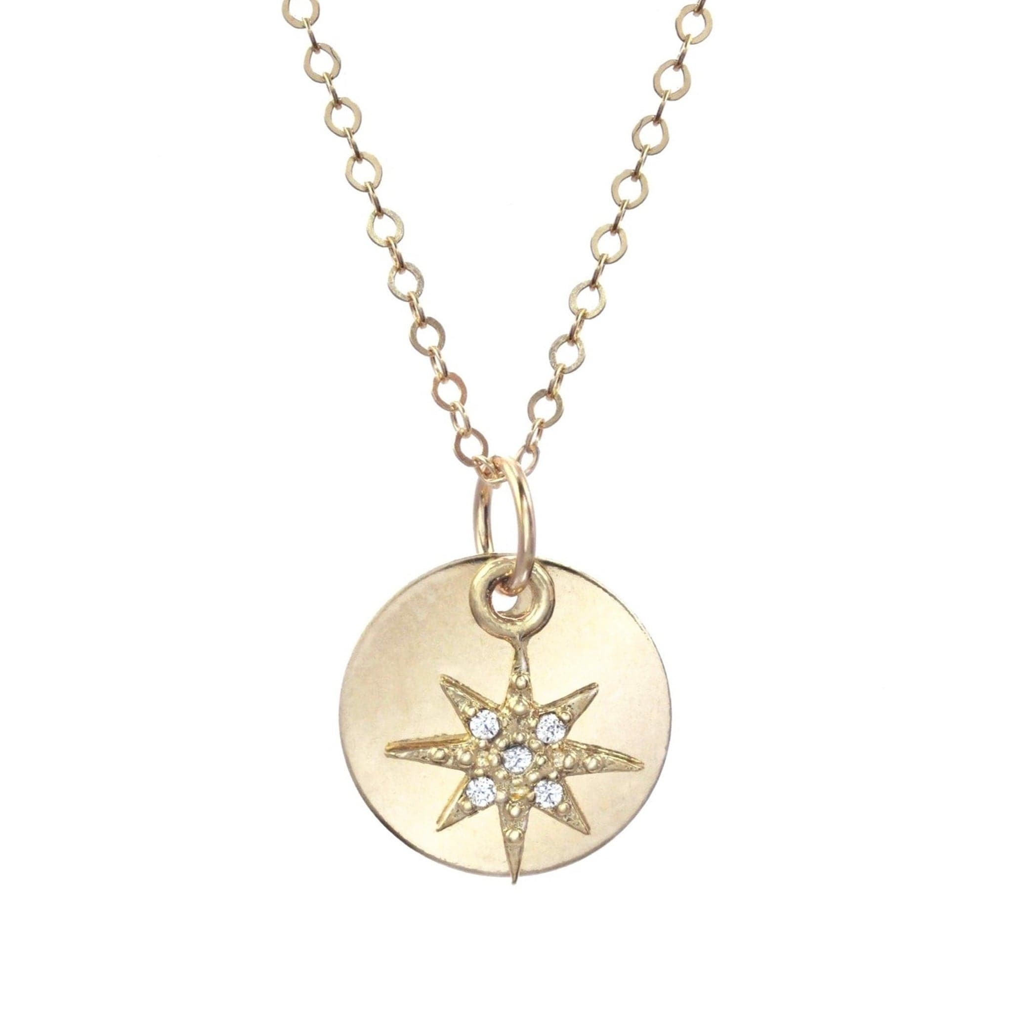 Long gold chain and circle gold pendant with crystal gemmed star charm.