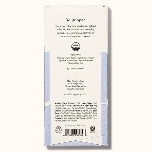 A chocolate bar with white and light purple packaging along with black letters at the top that read, "Mast Lavender Chocolate". The back reads off the ingredients and nutritional facts.