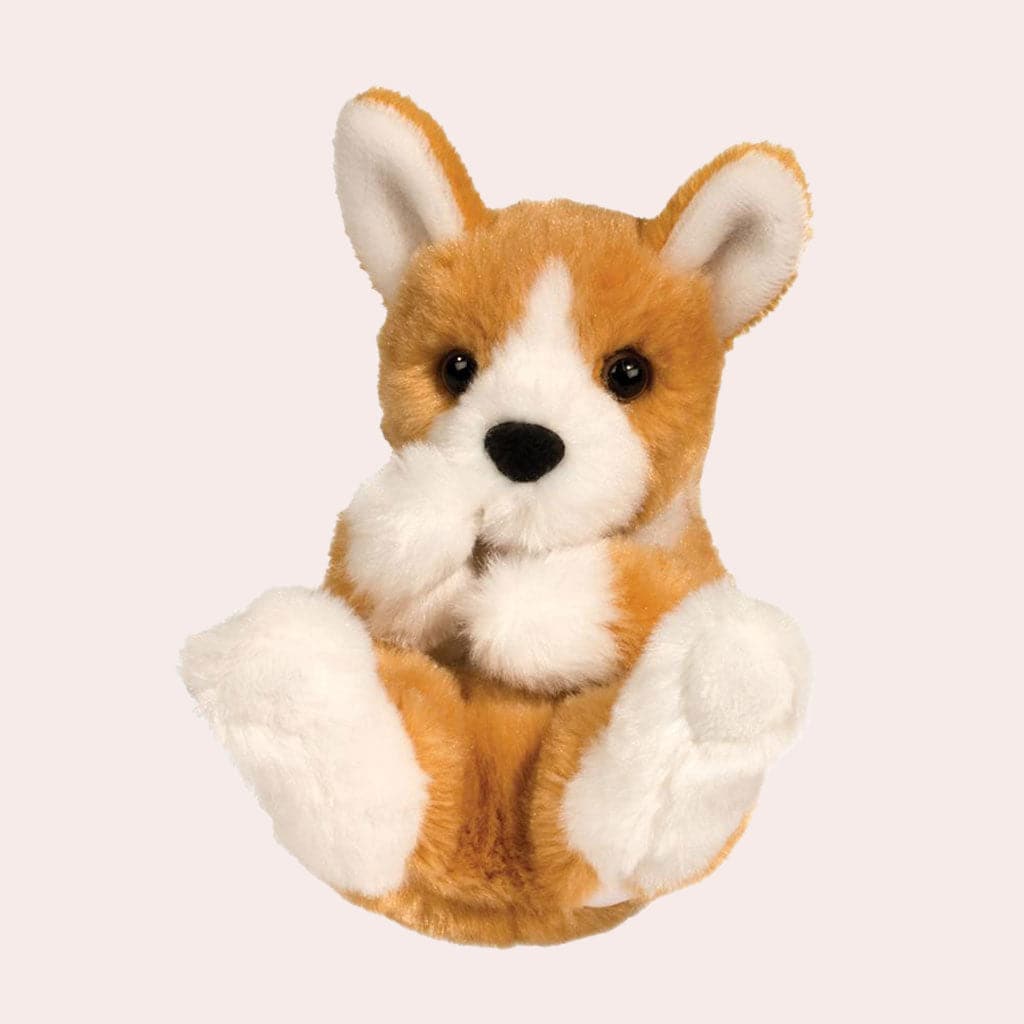 A golden colored corgi stuffed animal with white detailing.
