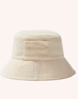 An ivory cotton bucket hat with a ribbed brim and a single side pocket.