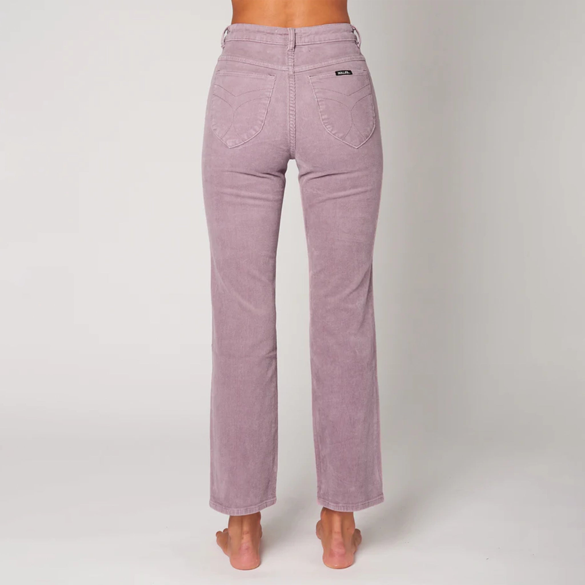 Straight legged corduroy pants with curved back pockets, a high waist and they come in a light purple shade.