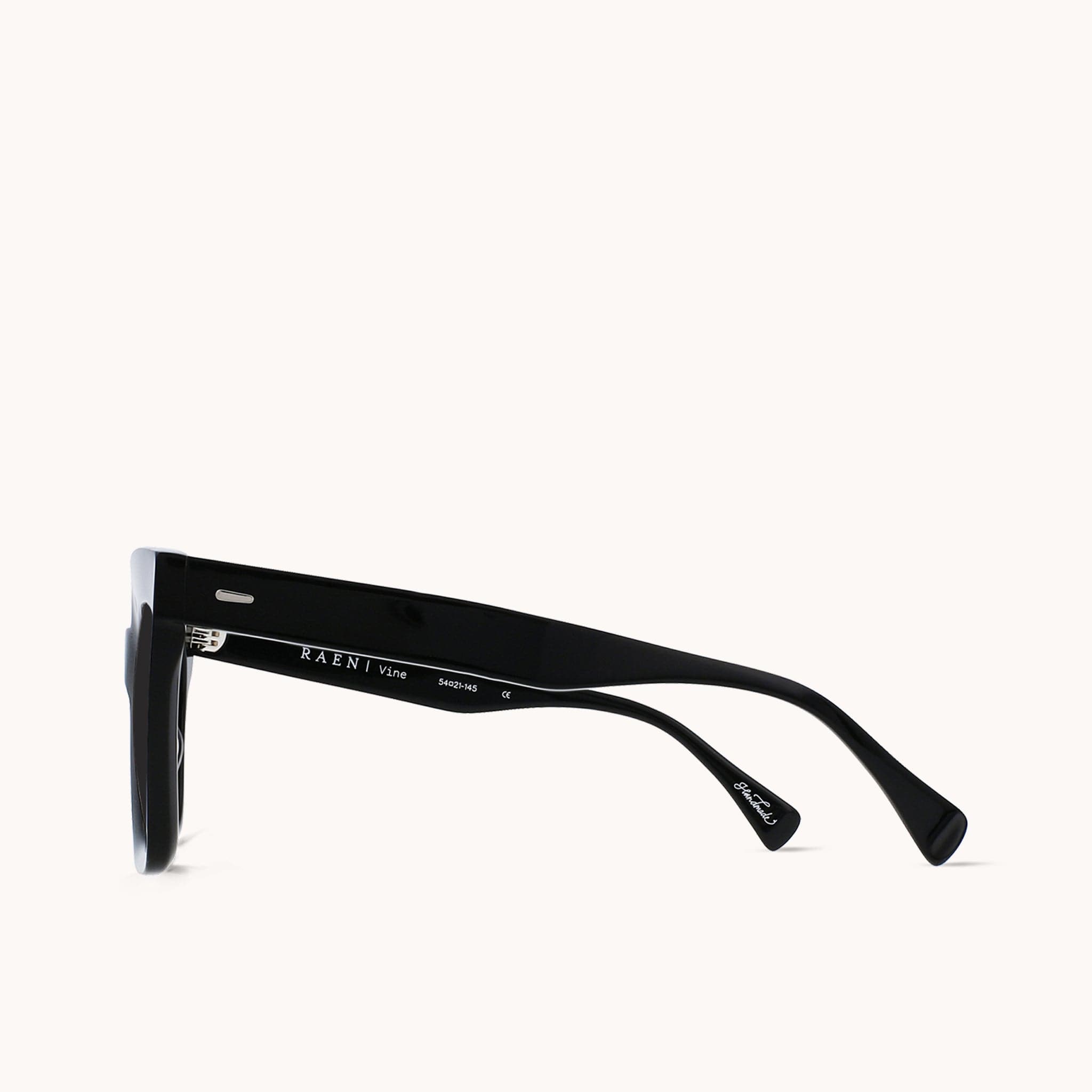 Side view of sunglasses highlighting the high quality acetate arms. The brand name 'Raen' is engraved on the inside of one of the arms.
