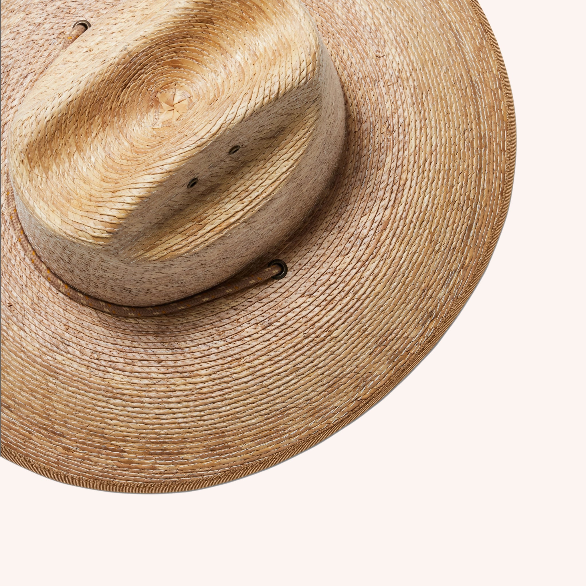 A darker brown straw sun hat with a wide curved brim and a drawstring.