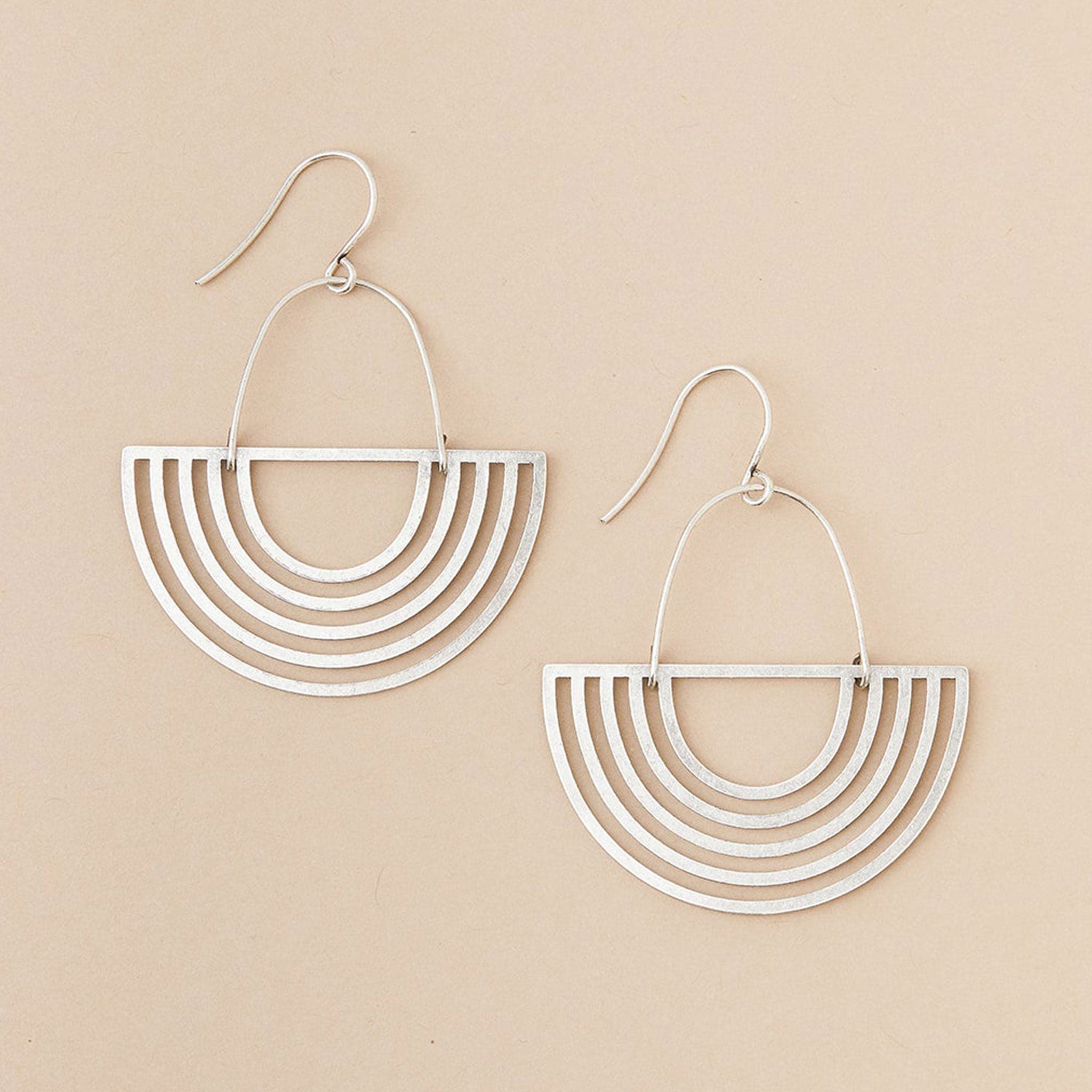 Two silver upside down arch earrings with a silver wire finding.