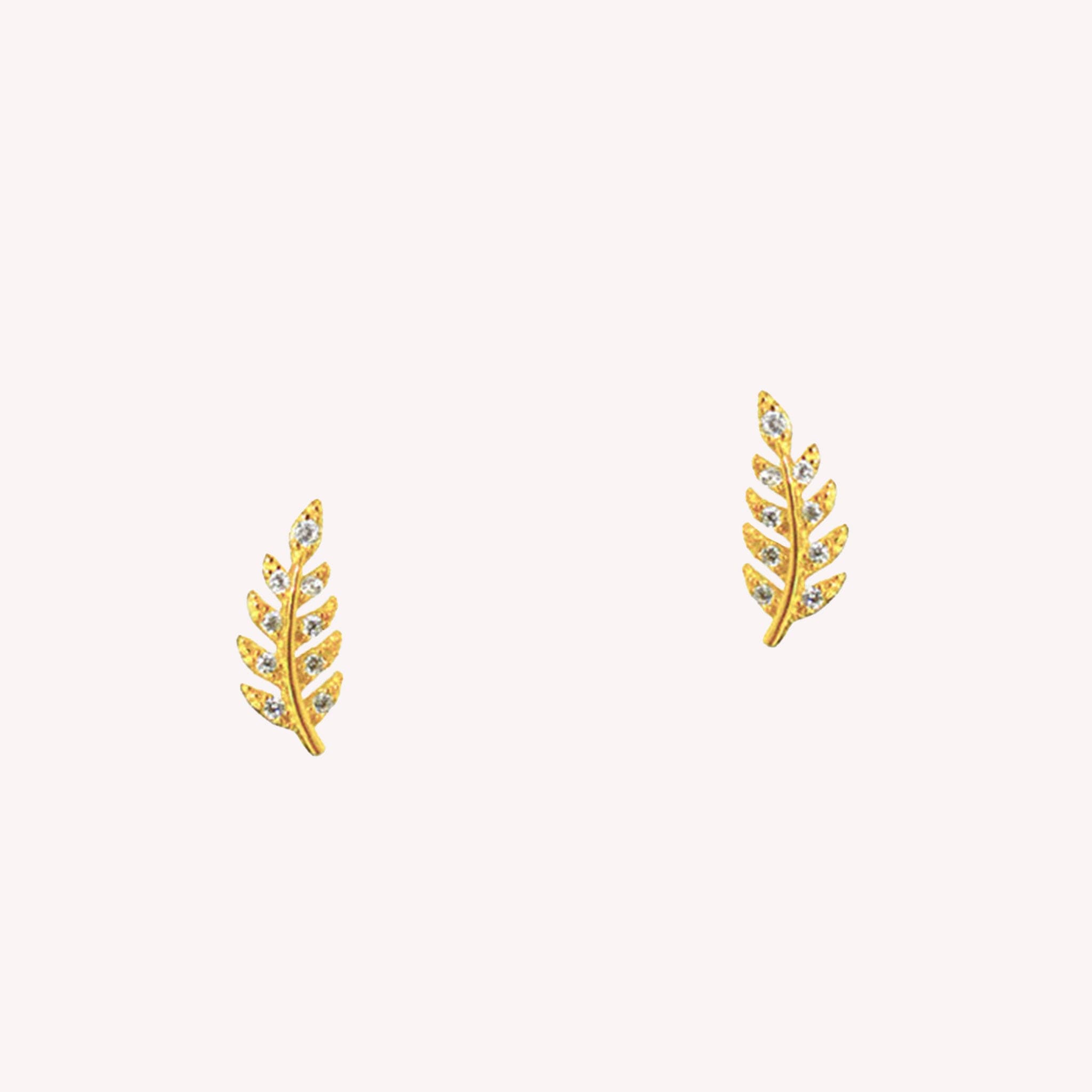 Gold leaf shaped earrings with a straight post backing and tiny cubic zirconias on each point of the leaf shape.