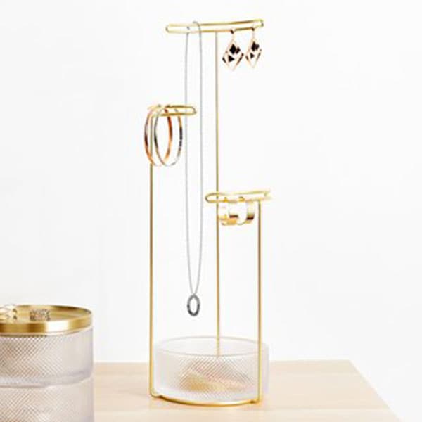 Tesora is designed with three posts of varying heights to accommodate jewelry of any length.  At the base of the tree is a dish, which allows for additional storage of smaller accessories, like earrings and brooches.  The stand’s unique double wire detailing on each post makes for a secure display of earrings or cufflinks. 