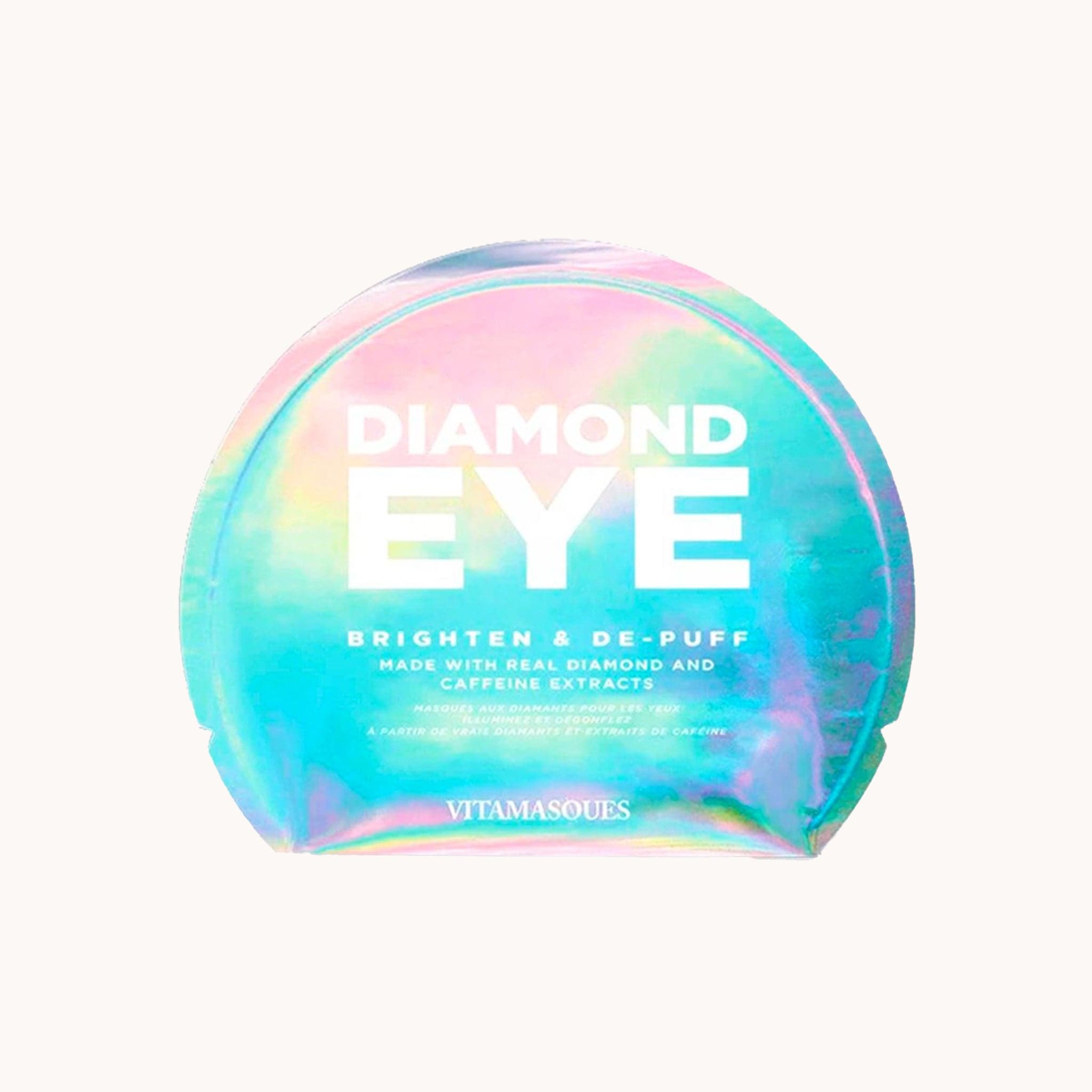 A holographic blue, green and purple packet of eye patches with white letters on the front that read, &quot;Diamond Eye Brighten &amp; De-Puff Made With Diamond And Caffeine Extracts&quot;.