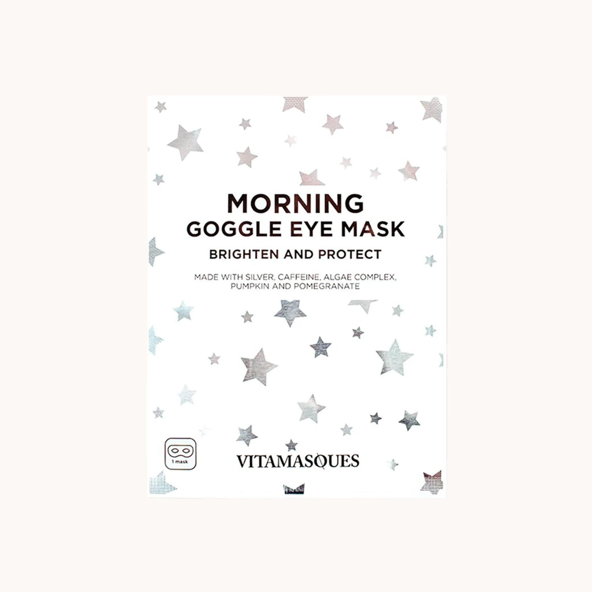 On a white background is a white packet of eye masks with silver star pattern all over along with black writing that reads, "Morning Google Eye Mask Brighten and Protect". 
