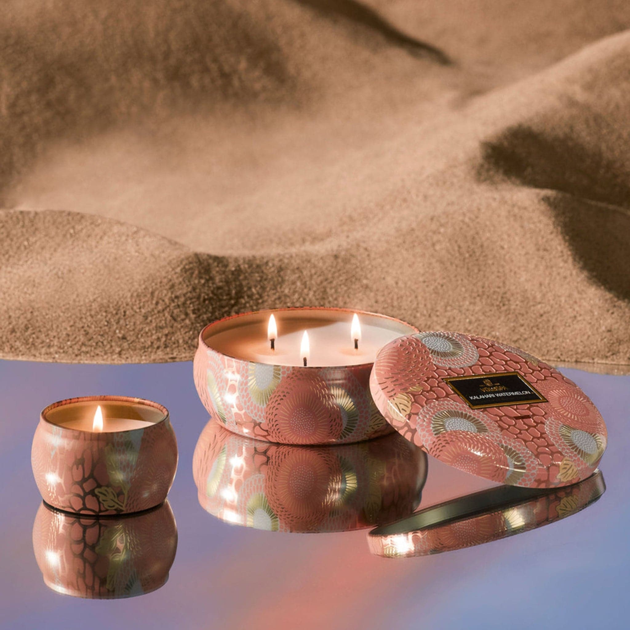 The Kalahari collection shown together with the mini tin and 3-wick tin. Its colors are beautiful and the jar&#39;s tin distributes light in a romantic way. Edit alt text